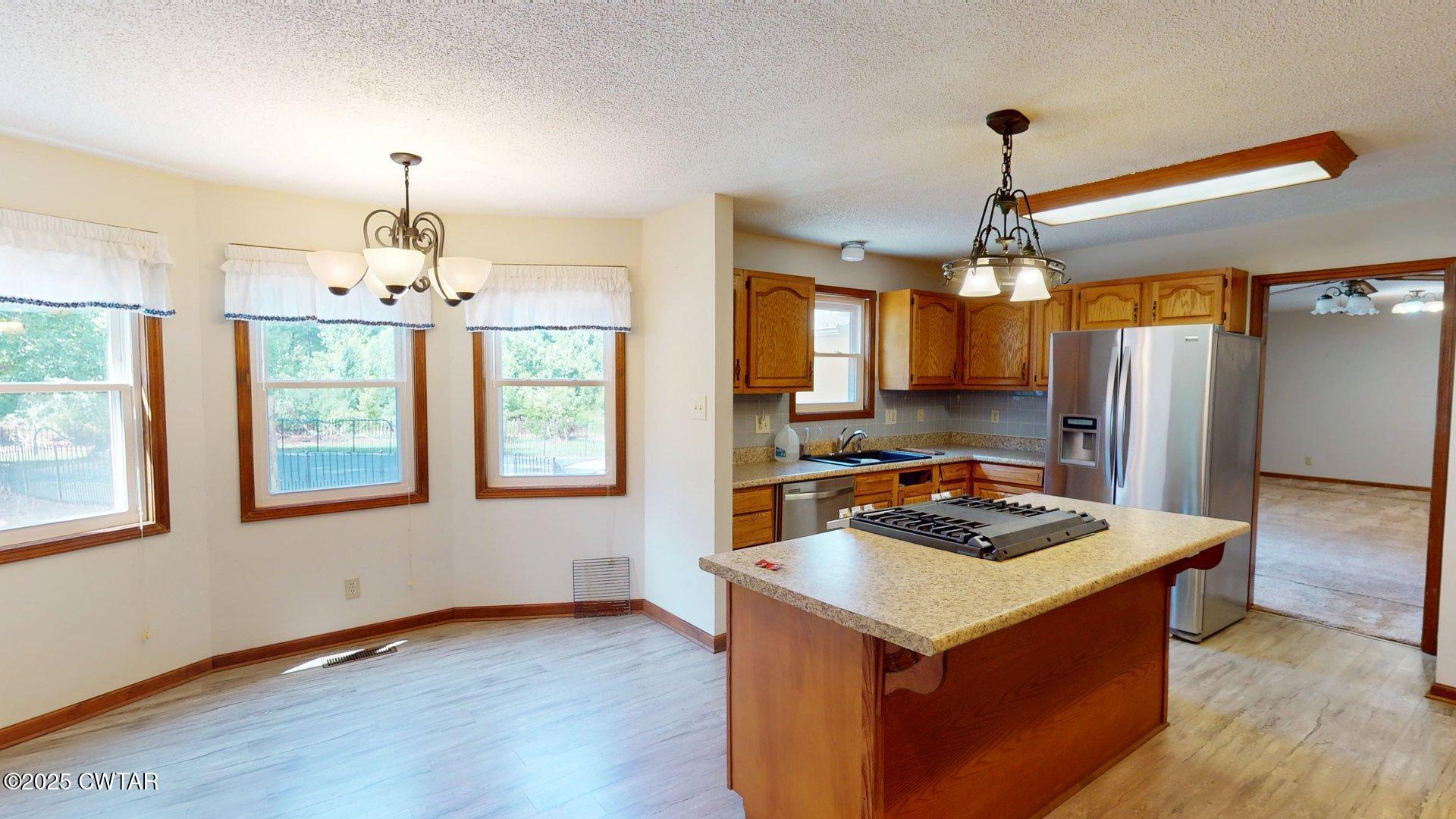 1921 Forrester Road Newbern, TN 38059 - Photo 6 of 18 a kitchen that has a lot of cabinets in it