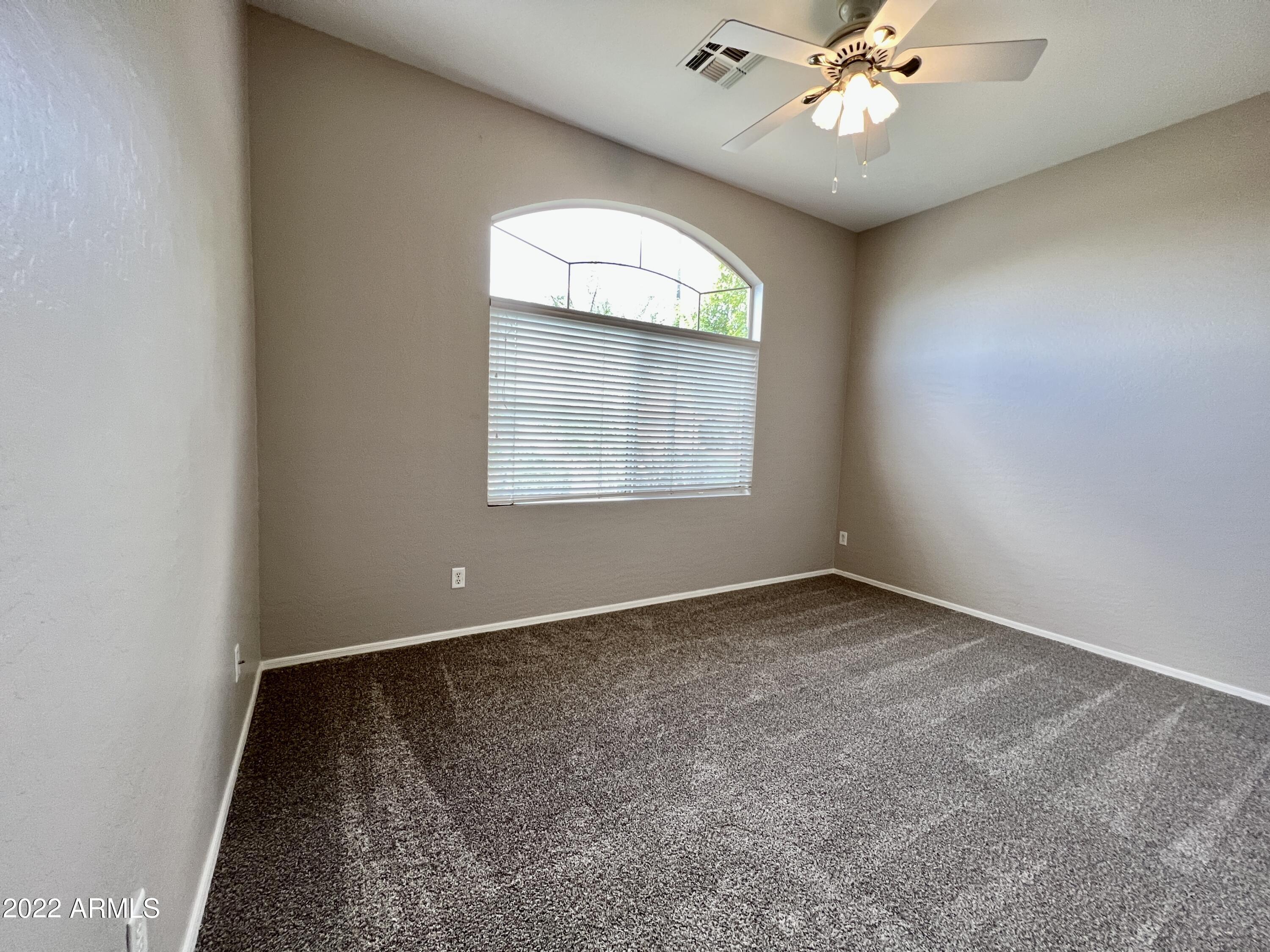 299 West Merrill Avenue Gilbert, AZ 85233 - Photo 11 of 18 an empty room with a window