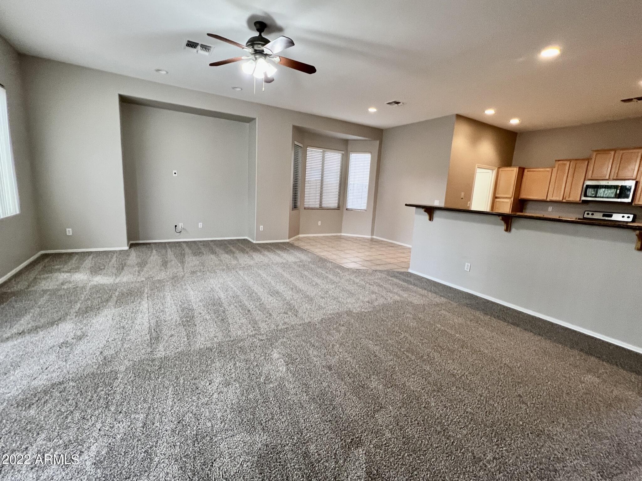 299 West Merrill Avenue Gilbert, AZ 85233 - Photo 4 of 18 a view of a kitchen with a sink and a window