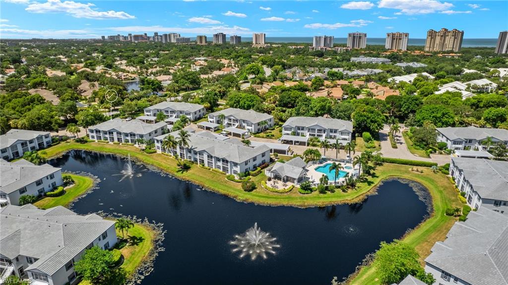 824 Tanbark Drive, Unit 104 Naples, FL 34108 - Photo 16 of 17 an aerial view of a swimming pool