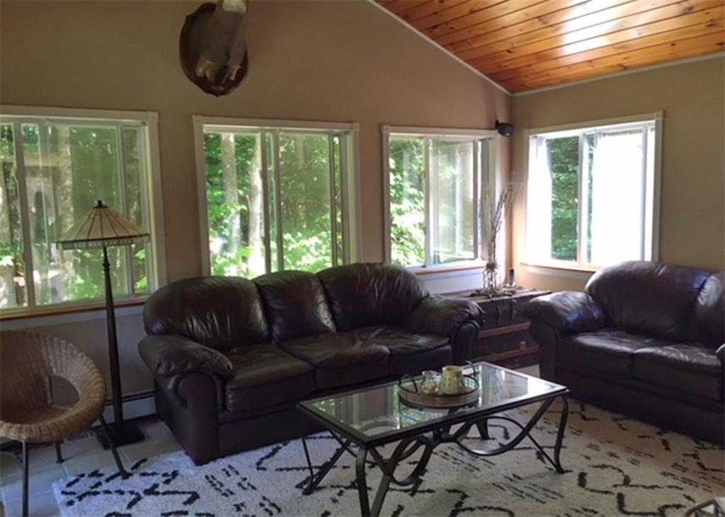 375 Hancock Pond Road Sebago, ME 04029 - Photo 16 of 34 Living room/Sunroom. A comfortable...