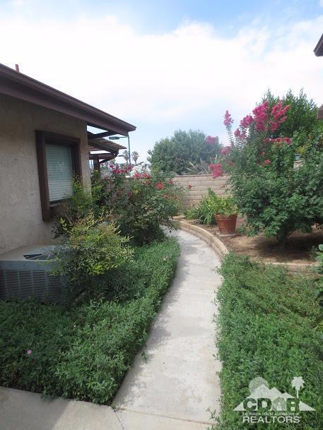 5959 Maybrook Circle Riverside, CA 92506 - Photo 3 of 18 a front view of a house with a yard