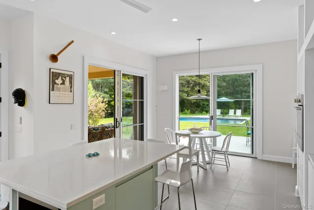a view of a dining room with furniture window and outside view