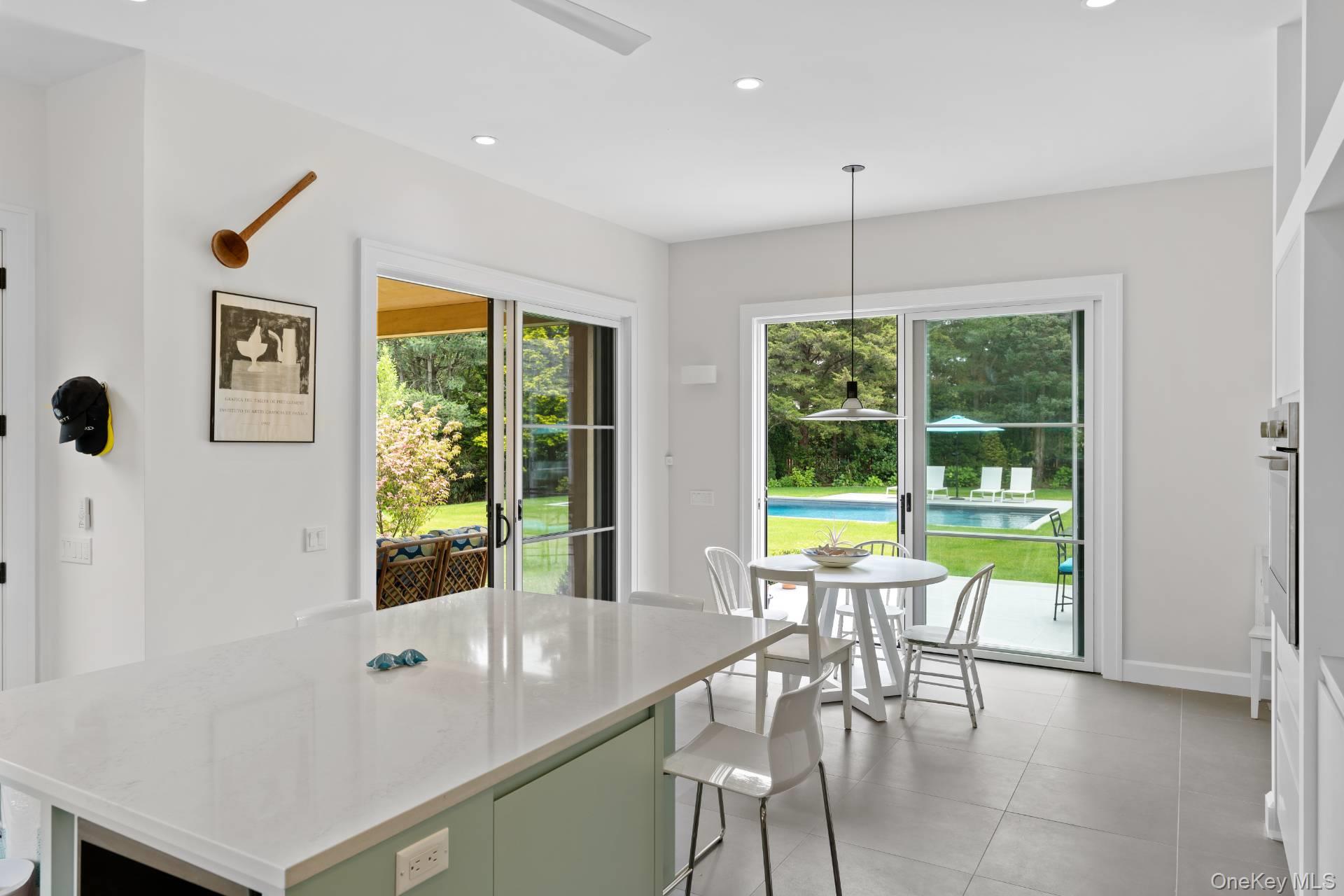 26 Georgian Lane Water Mill, NY 11976 - Photo 13 of 45 a view of a dining room with furniture window and outside view