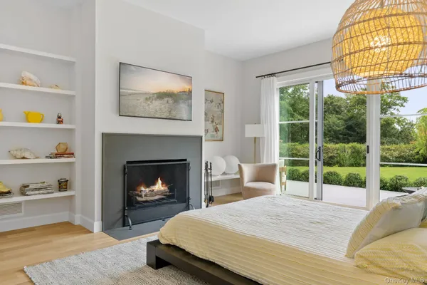 a bedroom with a bed and a fireplace