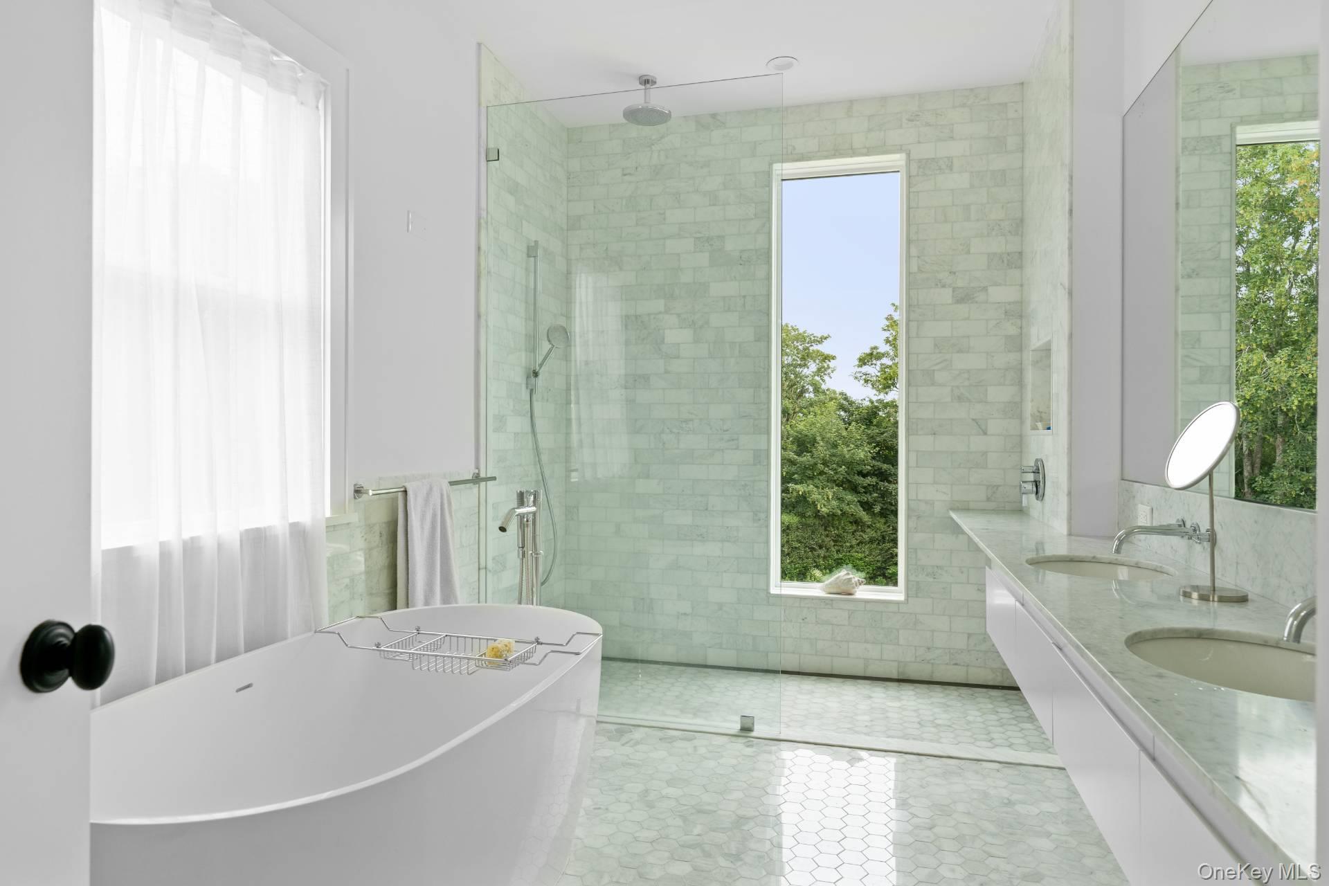 26 Georgian Lane Water Mill, NY 11976 - Photo 20 of 45 a bathroom with a tub sink and mirror