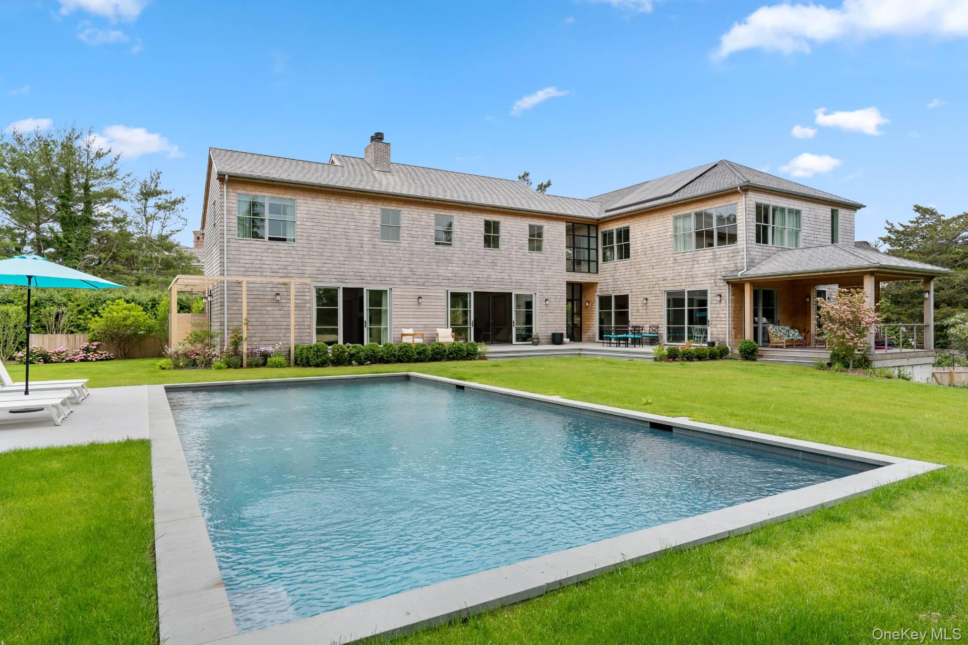 26 Georgian Lane Water Mill, NY 11976 - Photo 2 of 45 a view of house with swimming pool and yard