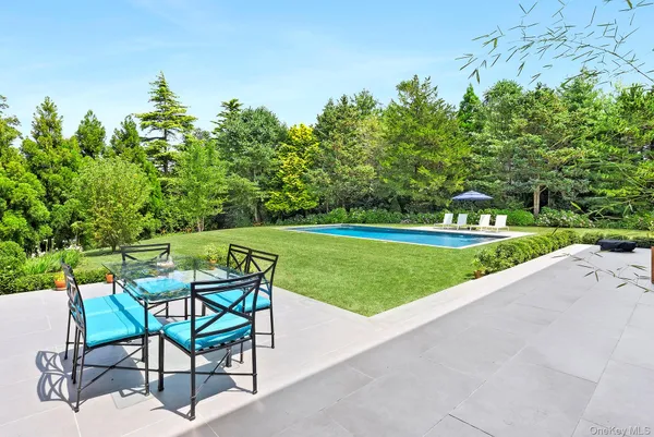 a view of a chairs and table in the garden