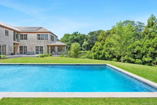 a view of an swimming pool with a yard