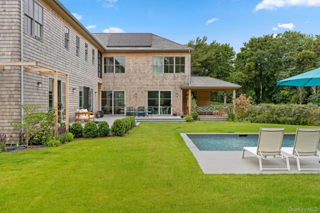 a view of a house with a yard porch and sitting area