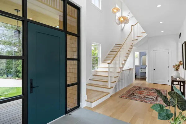 a view of entryway with furniture and rug