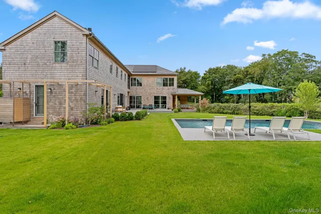 a view of a house with a yard porch and sitting area