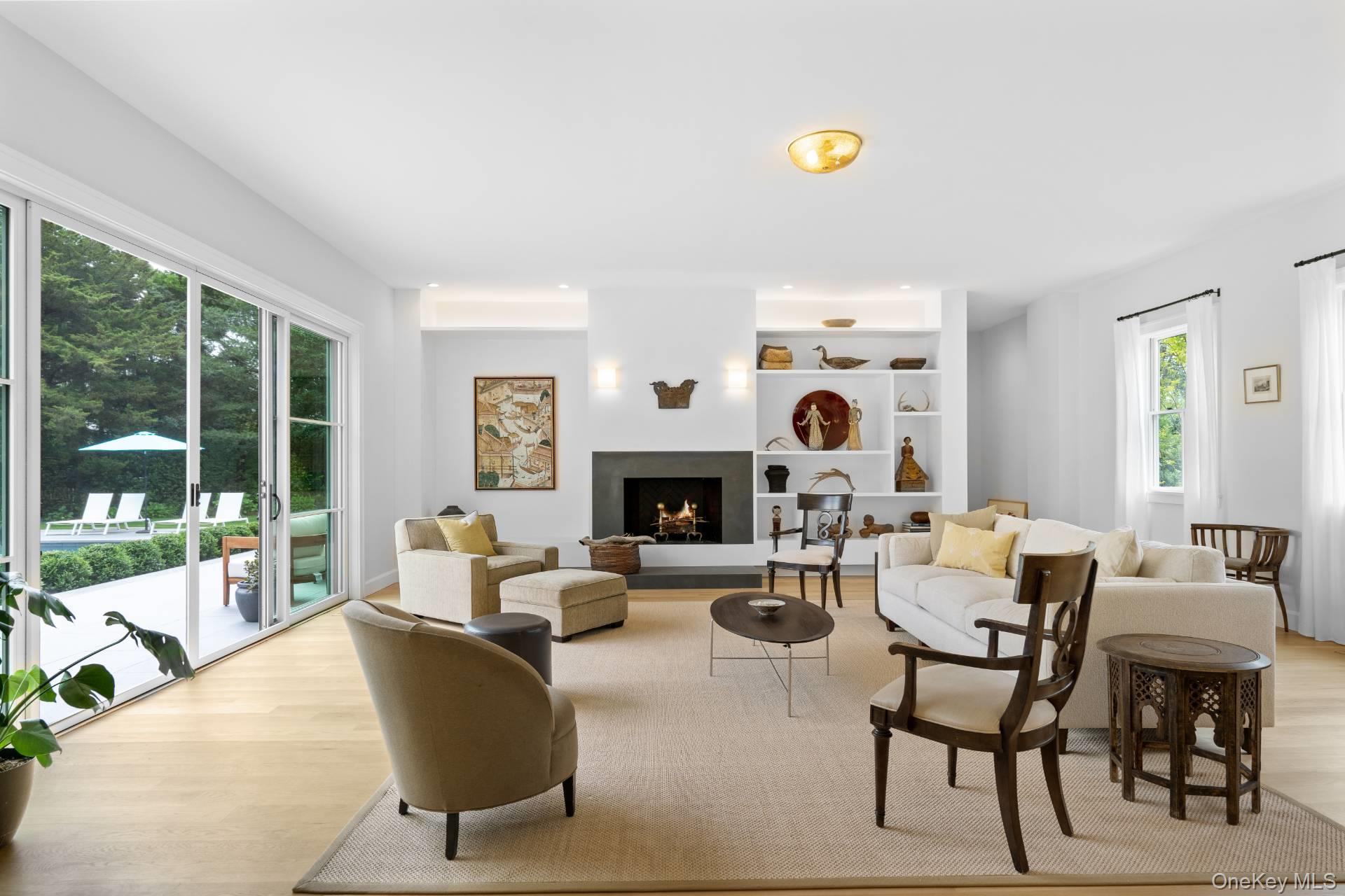 26 Georgian Lane Water Mill, NY 11976 - Photo 6 of 45 a living room with furniture and a fireplace