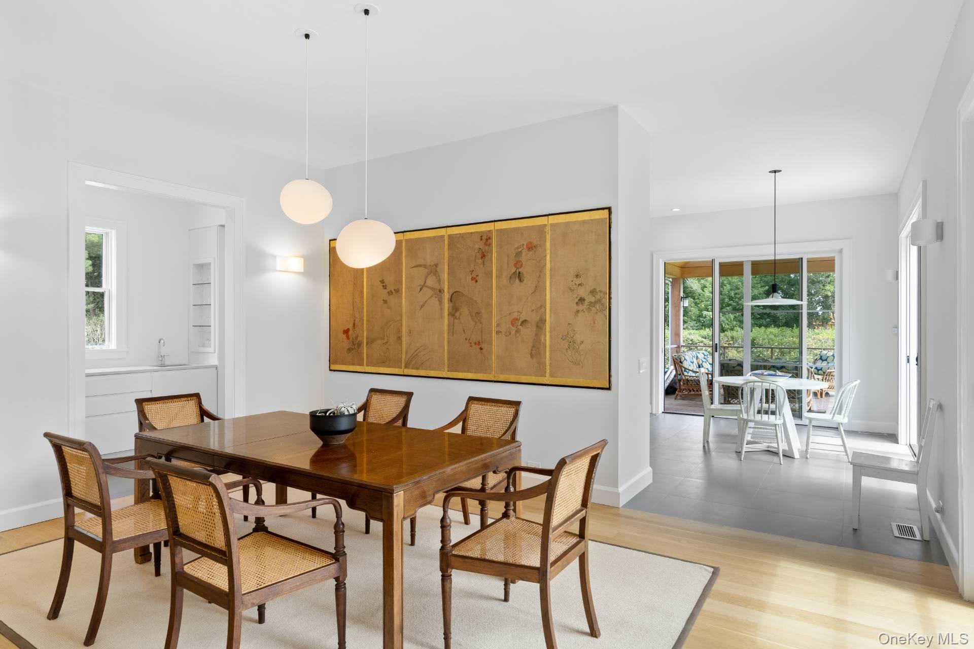 26 Georgian Lane Water Mill, NY 11976 - Photo 9 of 45 a view of a dining room with furniture and wooden floor