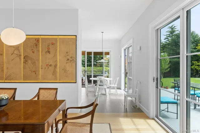 a view of a dining room with furniture window and outside view