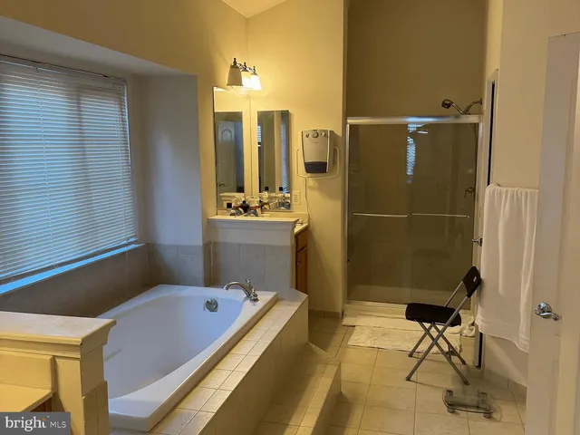a bathroom with a bath tub and a sink