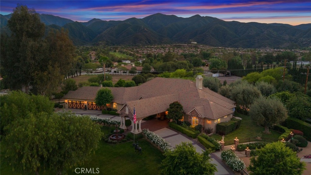 an aerial view of a house with mountain view