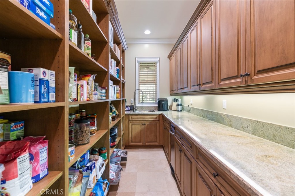 23965 Lawson Road Corona, CA 92883 - Photo 20 of 74 a kitchen with stainless steel appliances granite countertop a sink and cabinets