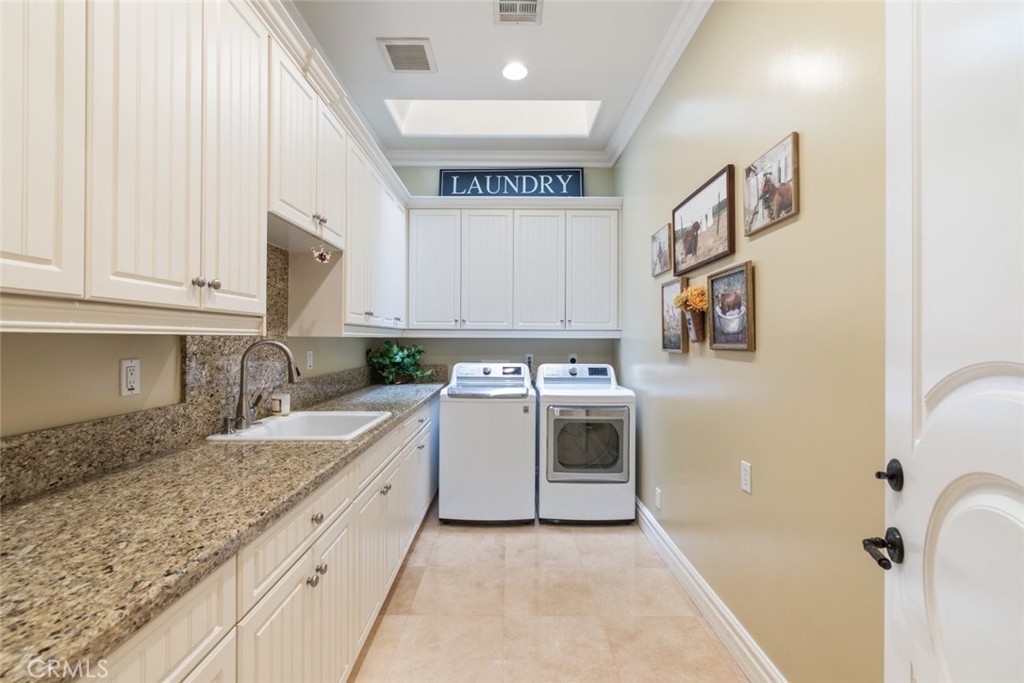 23965 Lawson Road Corona, CA 92883 - Photo 31 of 74 a kitchen with granite countertop a sink and a stove