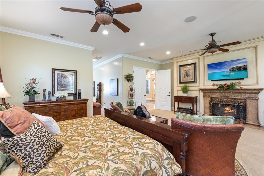23965 Lawson Road Corona, CA 92883 - Photo 36 of 74 a living room with fireplace furniture and a flat screen tv