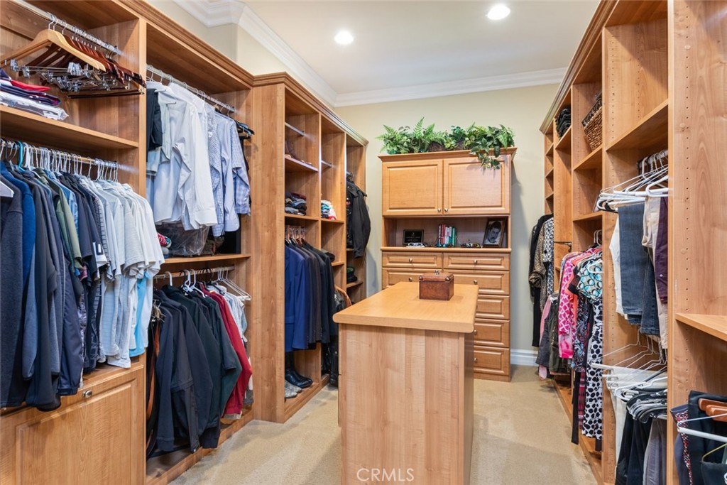 23965 Lawson Road Corona, CA 92883 - Photo 41 of 74 a view of walk in closet with clothes and shoes
