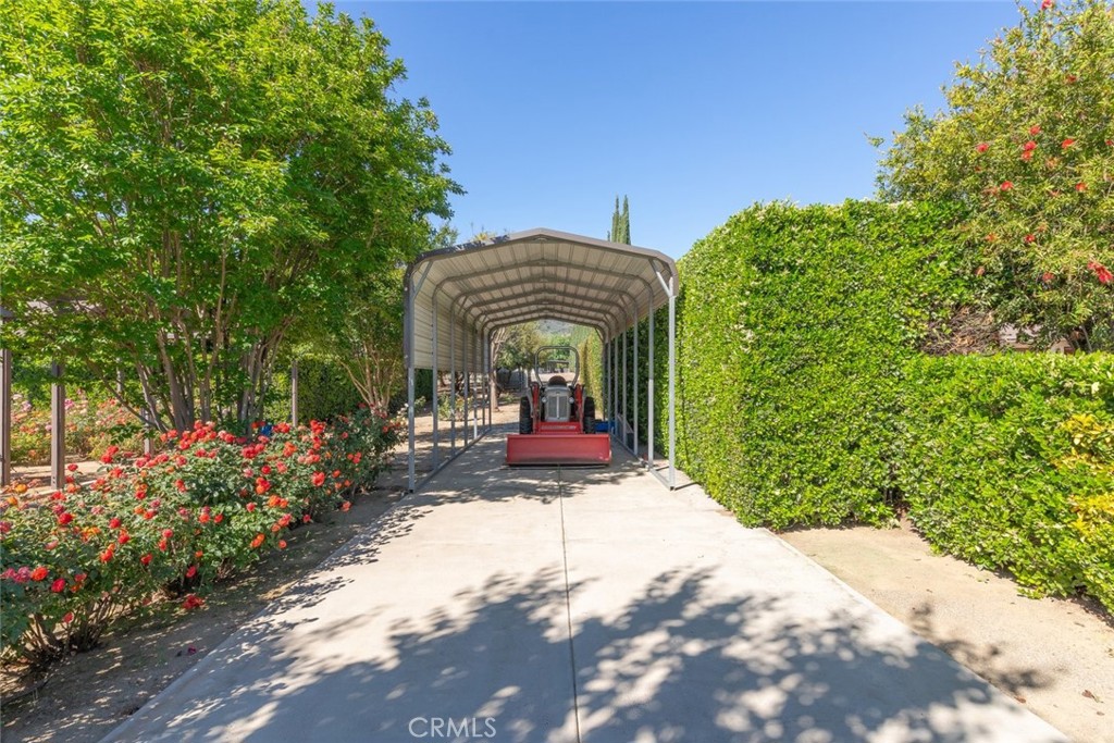 23965 Lawson Road Corona, CA 92883 - Photo 54 of 74 a view of a house with a porch and a yard
