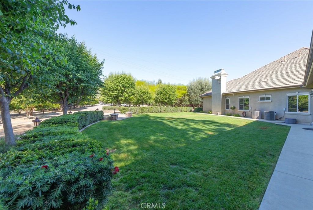 23965 Lawson Road Corona, CA 92883 - Photo 58 of 74 a view of a house with a back yard