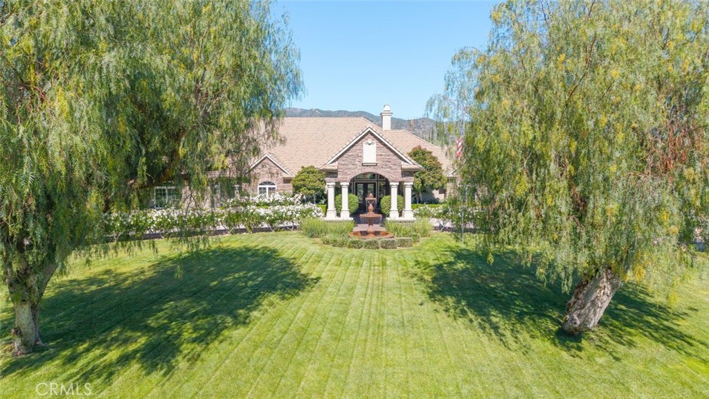 23965 Lawson Road Corona, CA 92883 - Photo 70 of 74 a view of house with garden space and trees