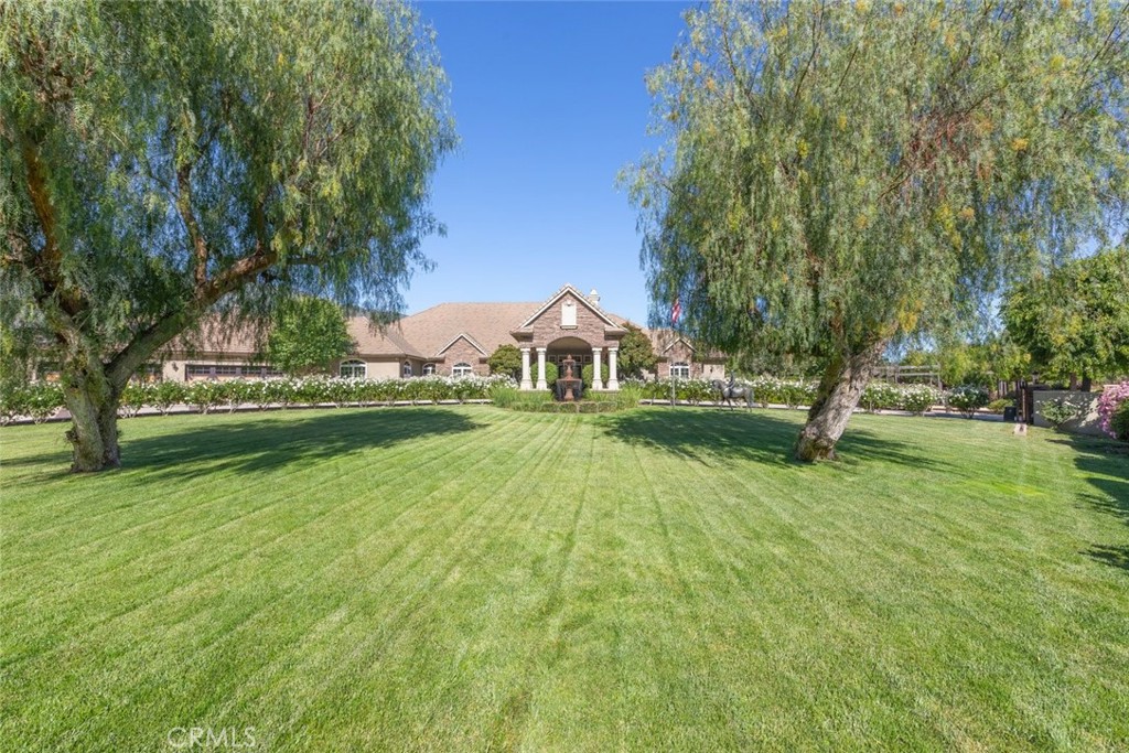 23965 Lawson Road Corona, CA 92883 - Photo 8 of 74 a view of a house with a big yard
