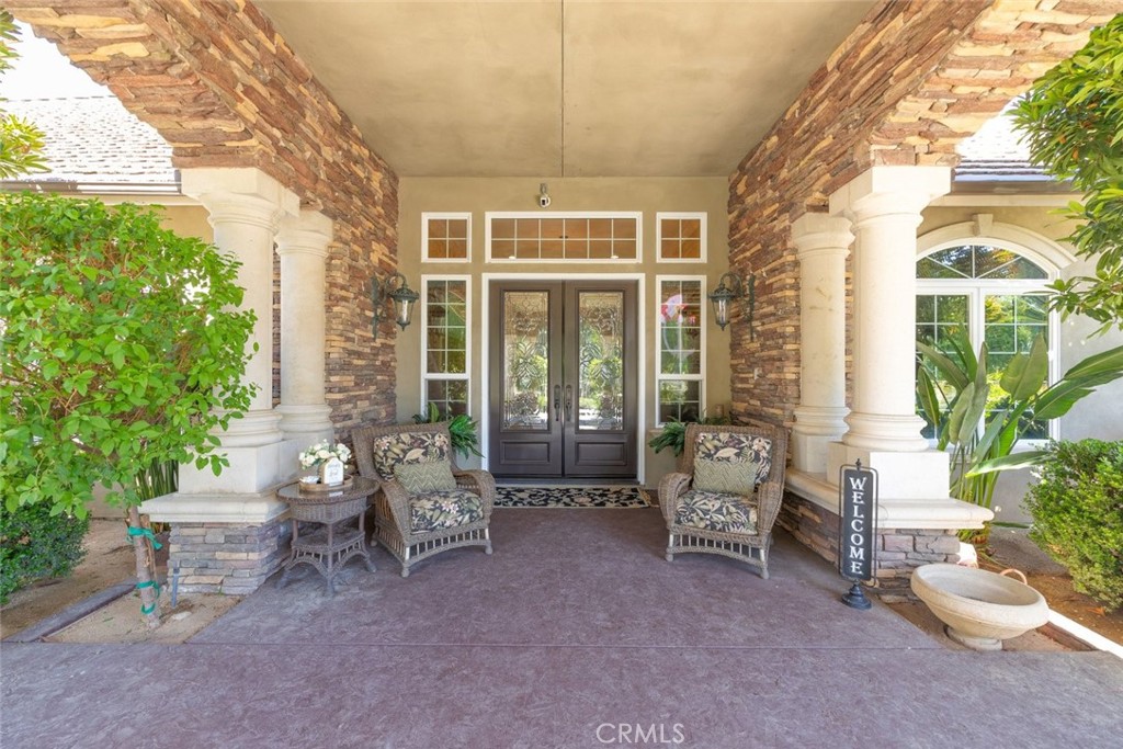 23965 Lawson Road Corona, CA 92883 - Photo 9 of 74 a living room filled with furniture and a potted plant