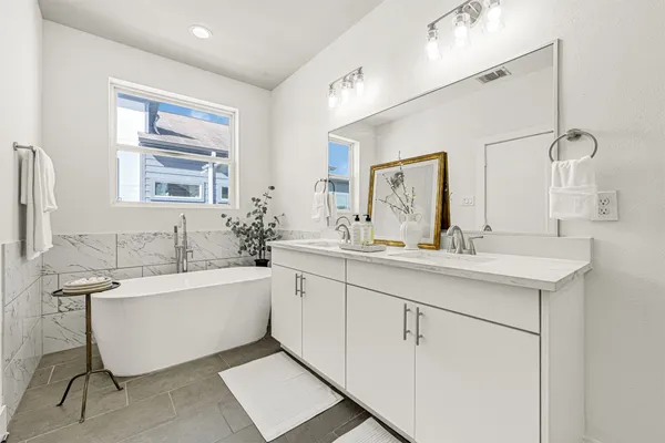 a bathroom with a shower sink and mirror