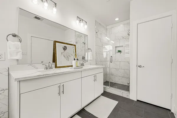 a kitchen with stainless steel appliances granite countertop a stove and a microwave