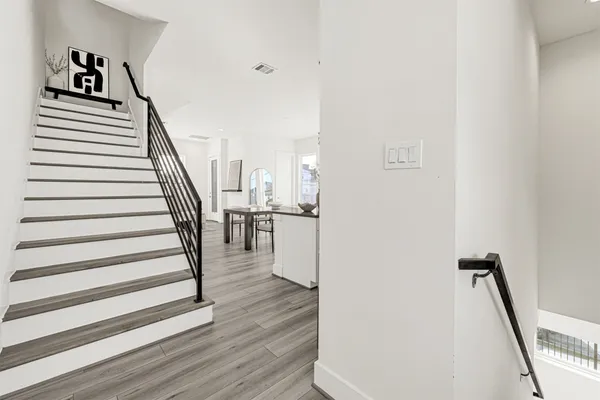 a kitchen with stainless steel appliances granite countertop a sink stove and microwave