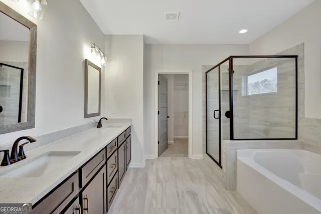 a view of storage and utility room with closet