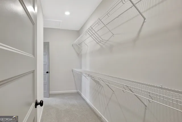 a view of a hallway with stairs