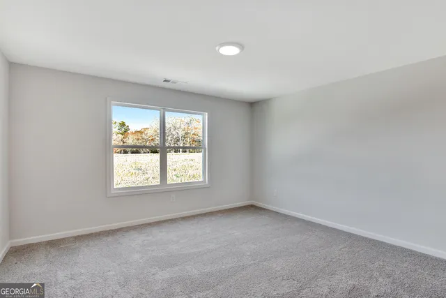 a bathroom with a bathtub shower sink vanity mirror and toilet