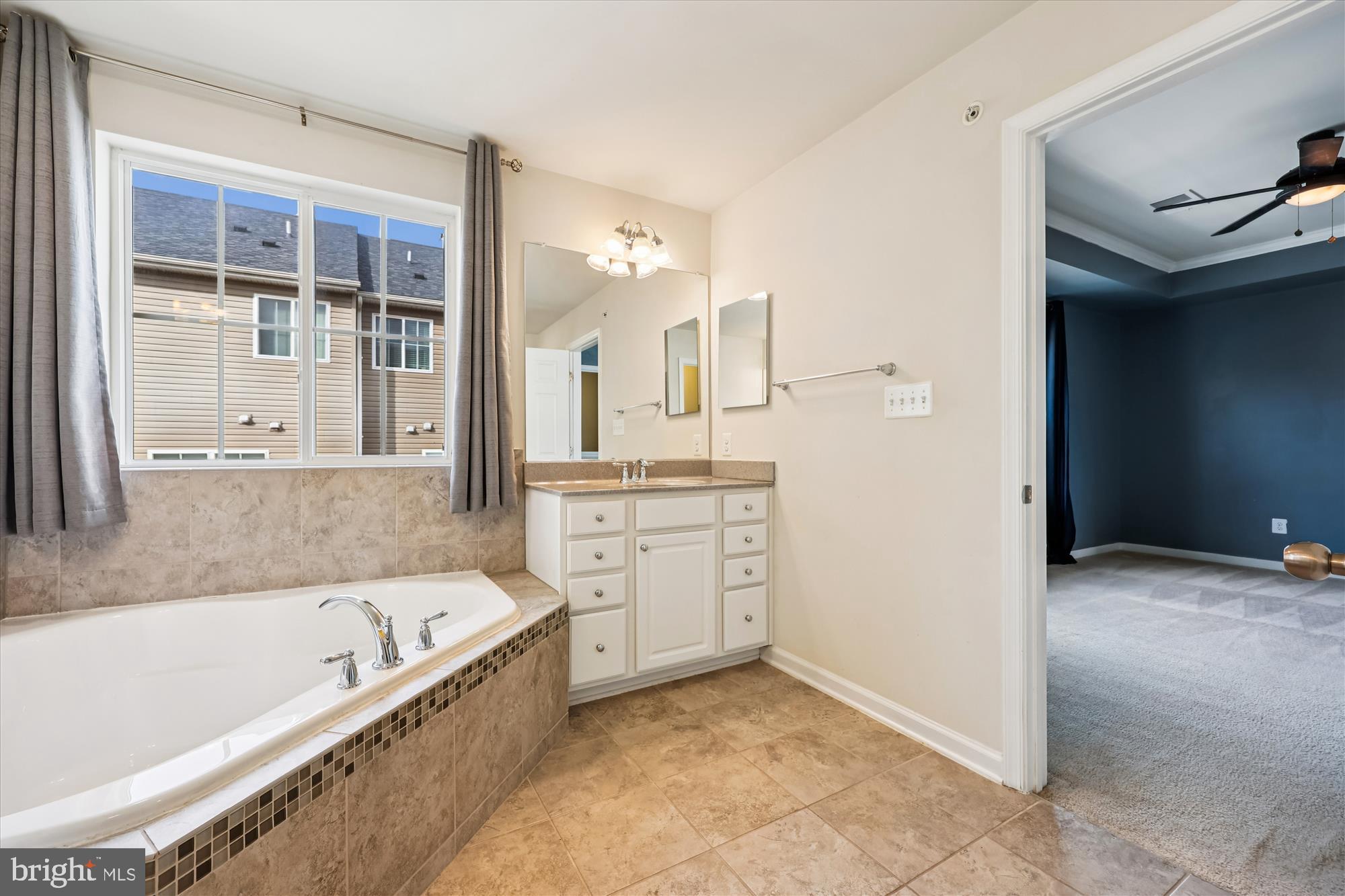 6146 Murray Terrace Frederick, MD 21703 - Photo 18 of 53 a bathroom with a bathtub and a sink