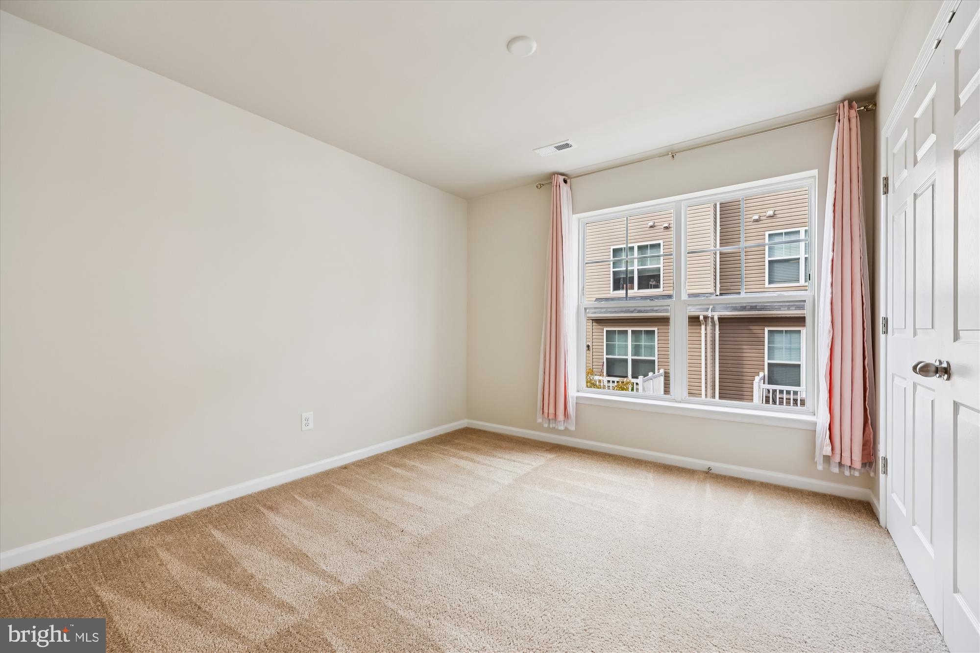 6146 Murray Terrace Frederick, MD 21703 - Photo 19 of 53 a view of an empty room with a window