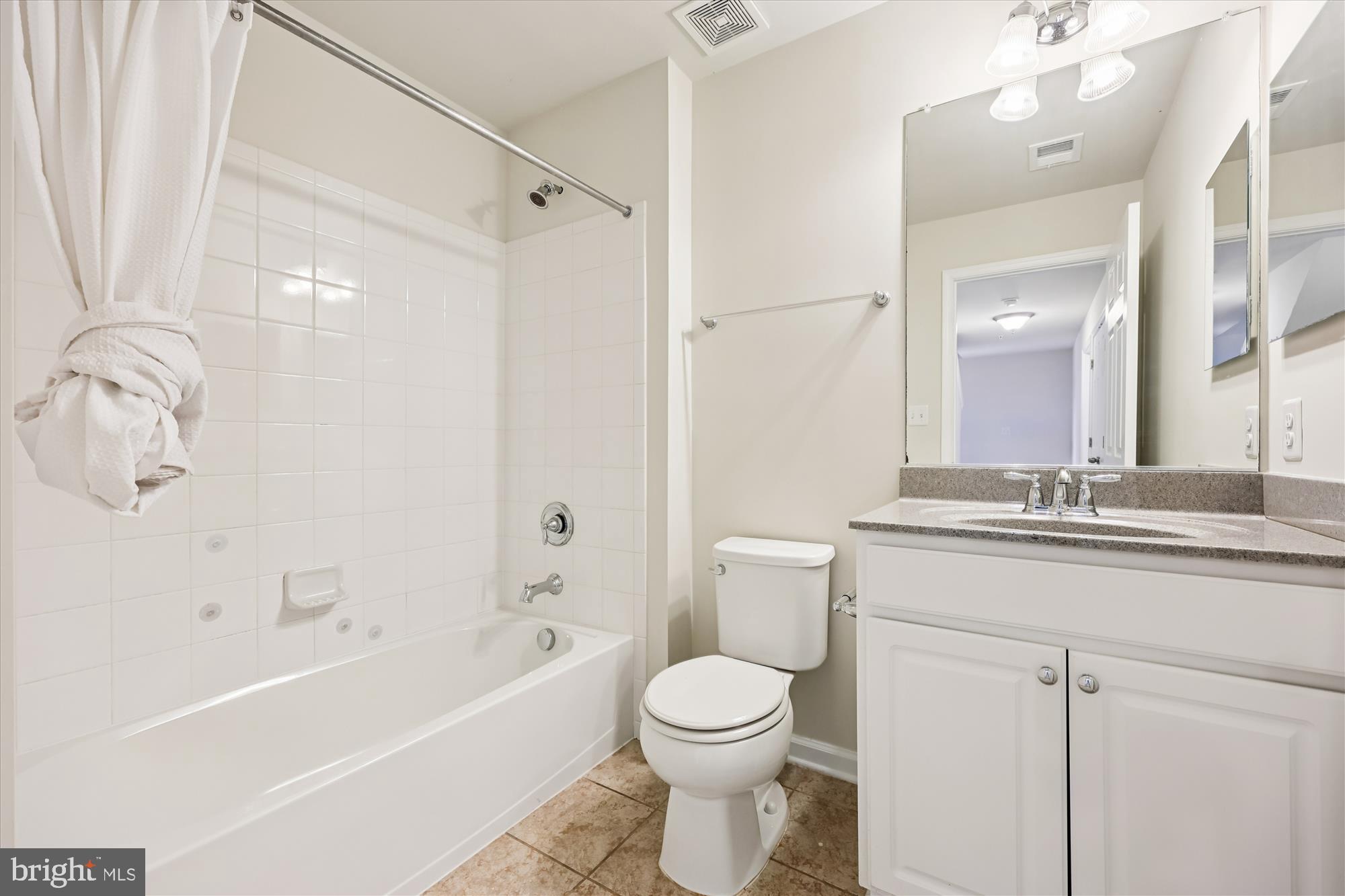 6146 Murray Terrace Frederick, MD 21703 - Photo 21 of 53 a bathroom with a toilet sink vanity tub and shower