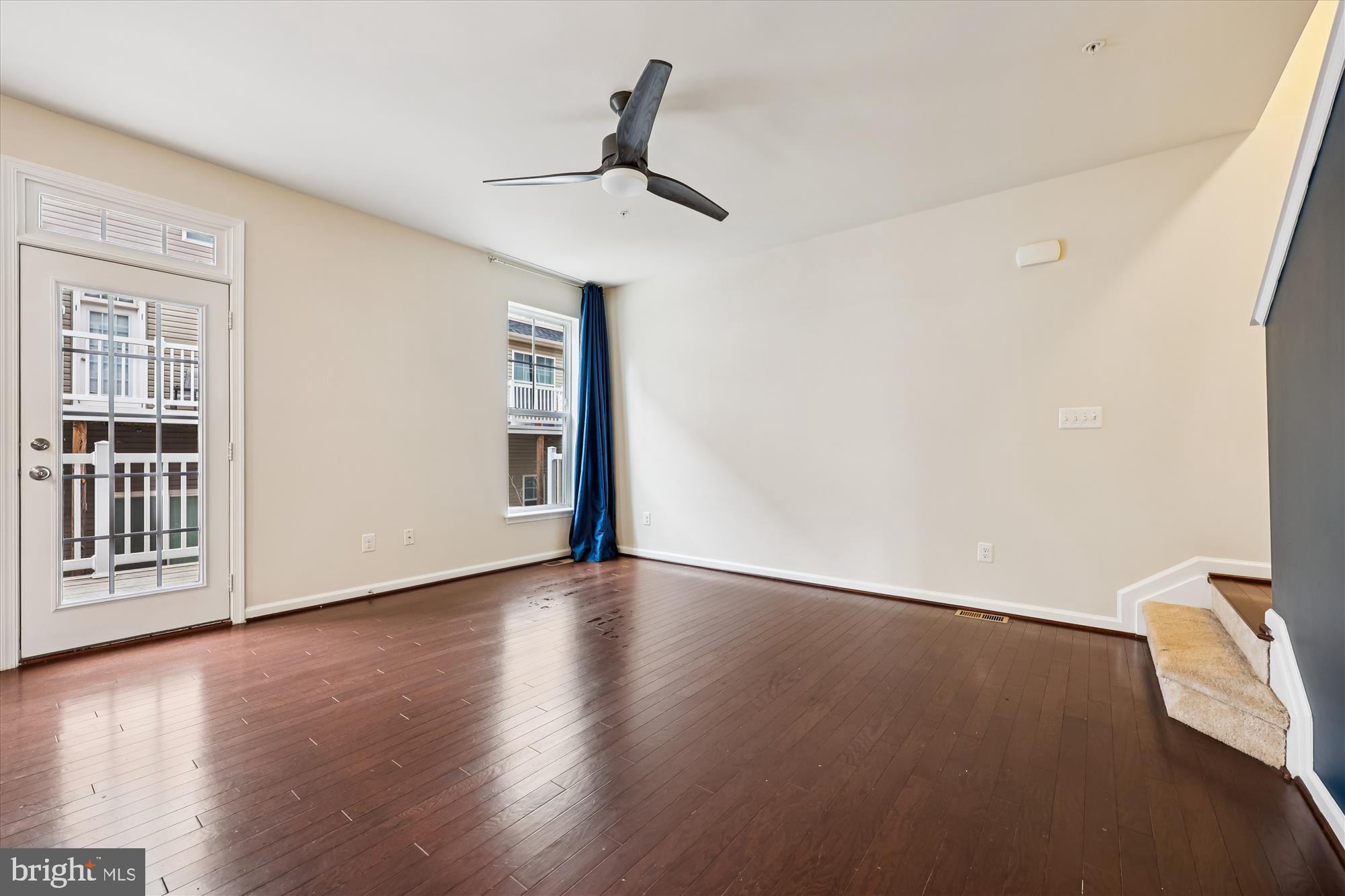 6146 Murray Terrace Frederick, MD 21703 - Photo 10 of 53 a view of an empty room with wooden floor and a window