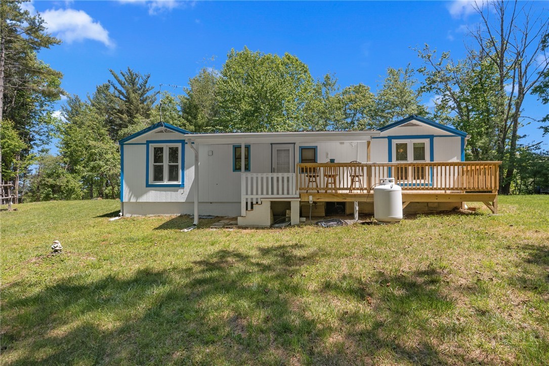 154 Folger Road Sparta, NC 28675 - Photo 17 of 37 a house view with a garden space