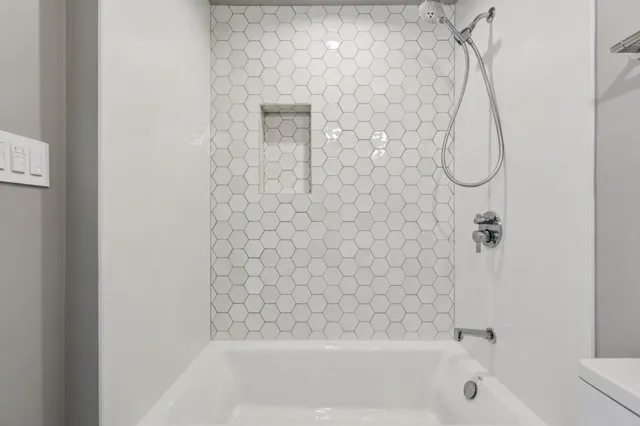 a bathroom with a bath tub and a shower