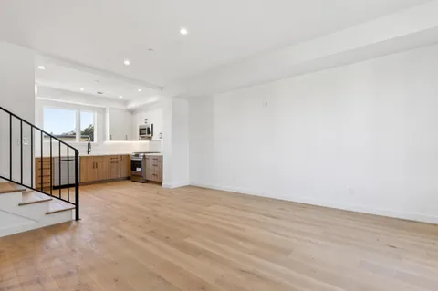 a view of a kitchen with a sink and a window