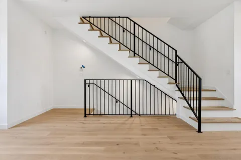 a view of entryway with wooden floor