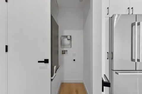 a view of bathroom with a tub and shower