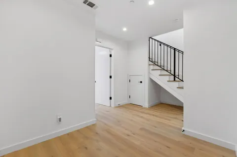 a view of an empty room with stairs