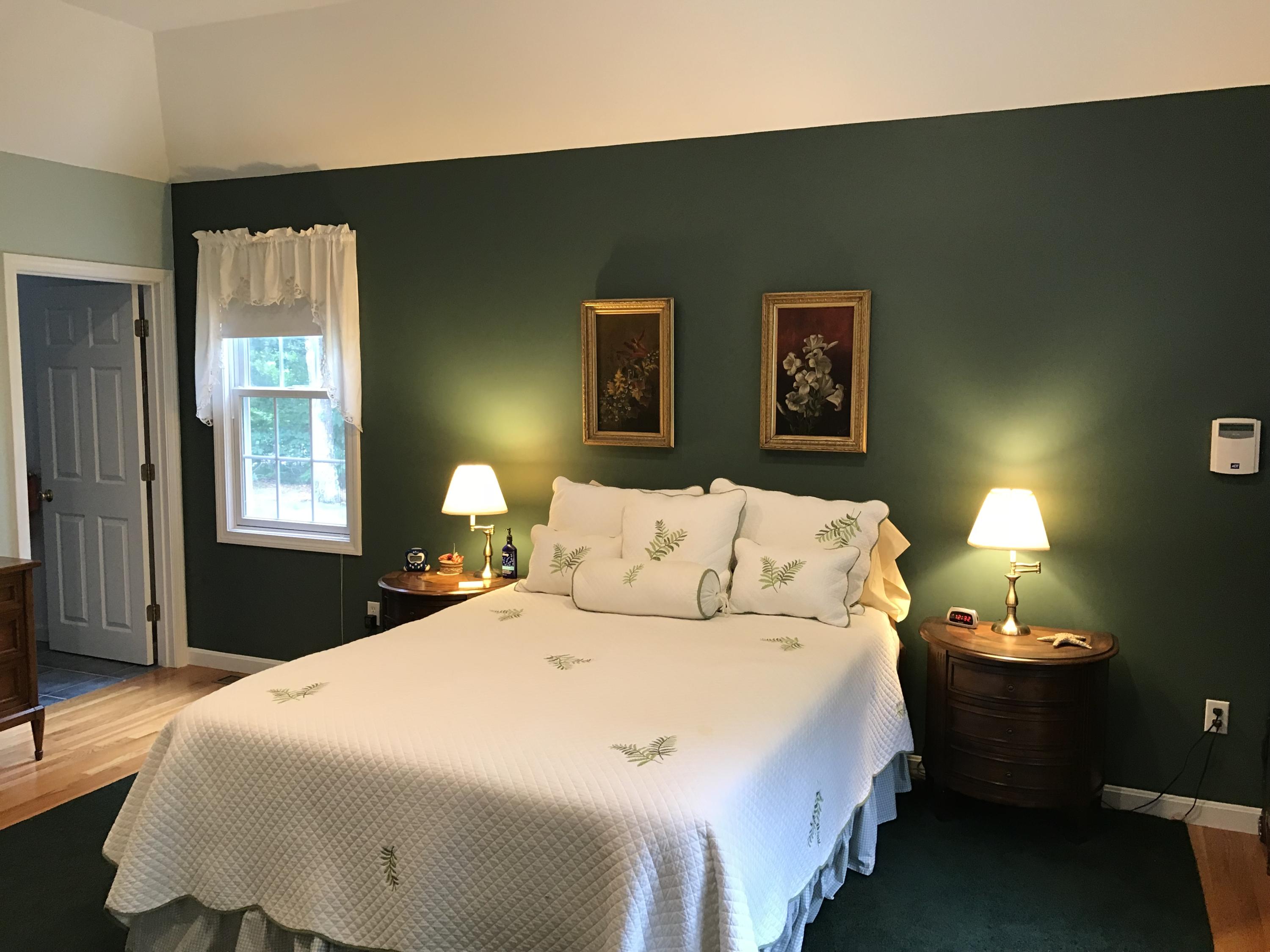 40 Amos Landing Road Mashpee, MA 02649 - Photo 12 of 28 a bedroom with a bed and window