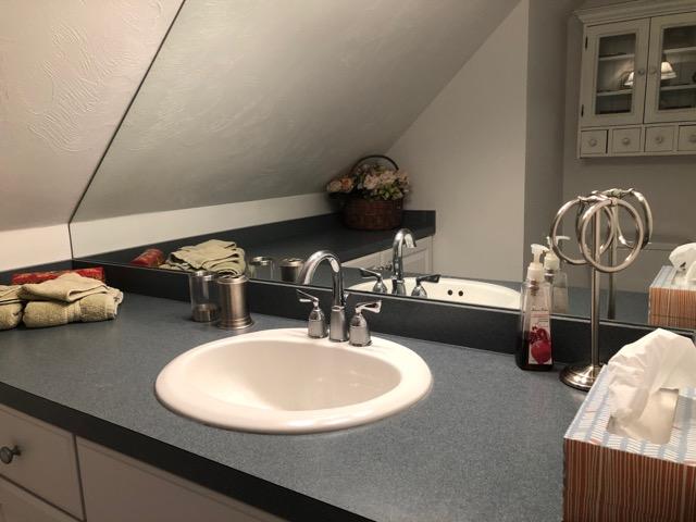 40 Amos Landing Road Mashpee, MA 02649 - Photo 20 of 28 a bathroom with a sink and a mirror