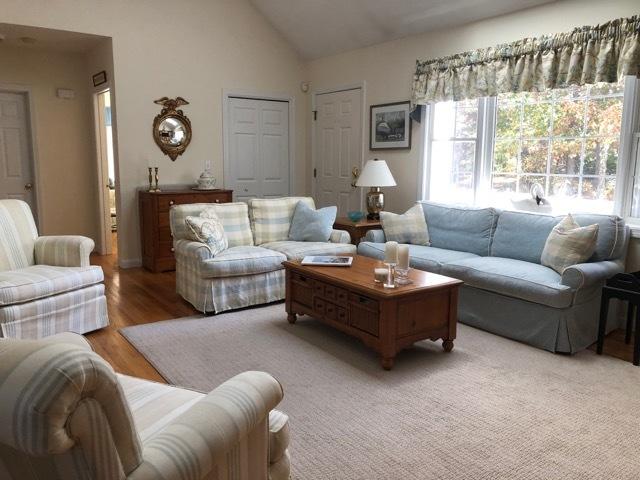 40 Amos Landing Road Mashpee, MA 02649 - Photo 2 of 28 a living room with furniture and a large window