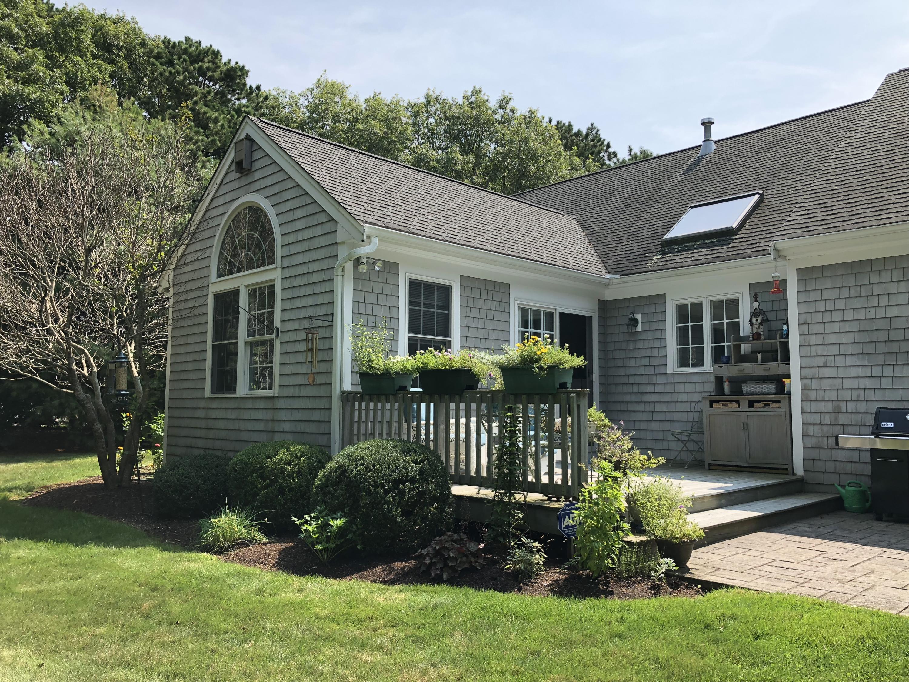 40 Amos Landing Road Mashpee, MA 02649 - Photo 26 of 28 a view of a house with a yard and plants